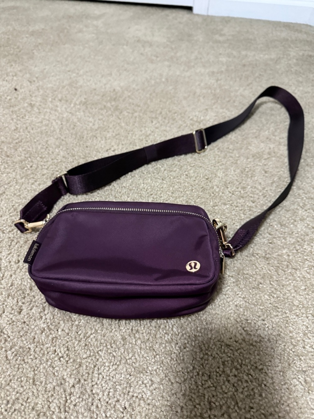 lululemon athletica Deep Plum Crossbody Bag with Gold Hardware